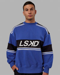 Man wearing Unisex A-Team Sweater Oversize - Power Cobalt-Black | Thumbnail Index: 5