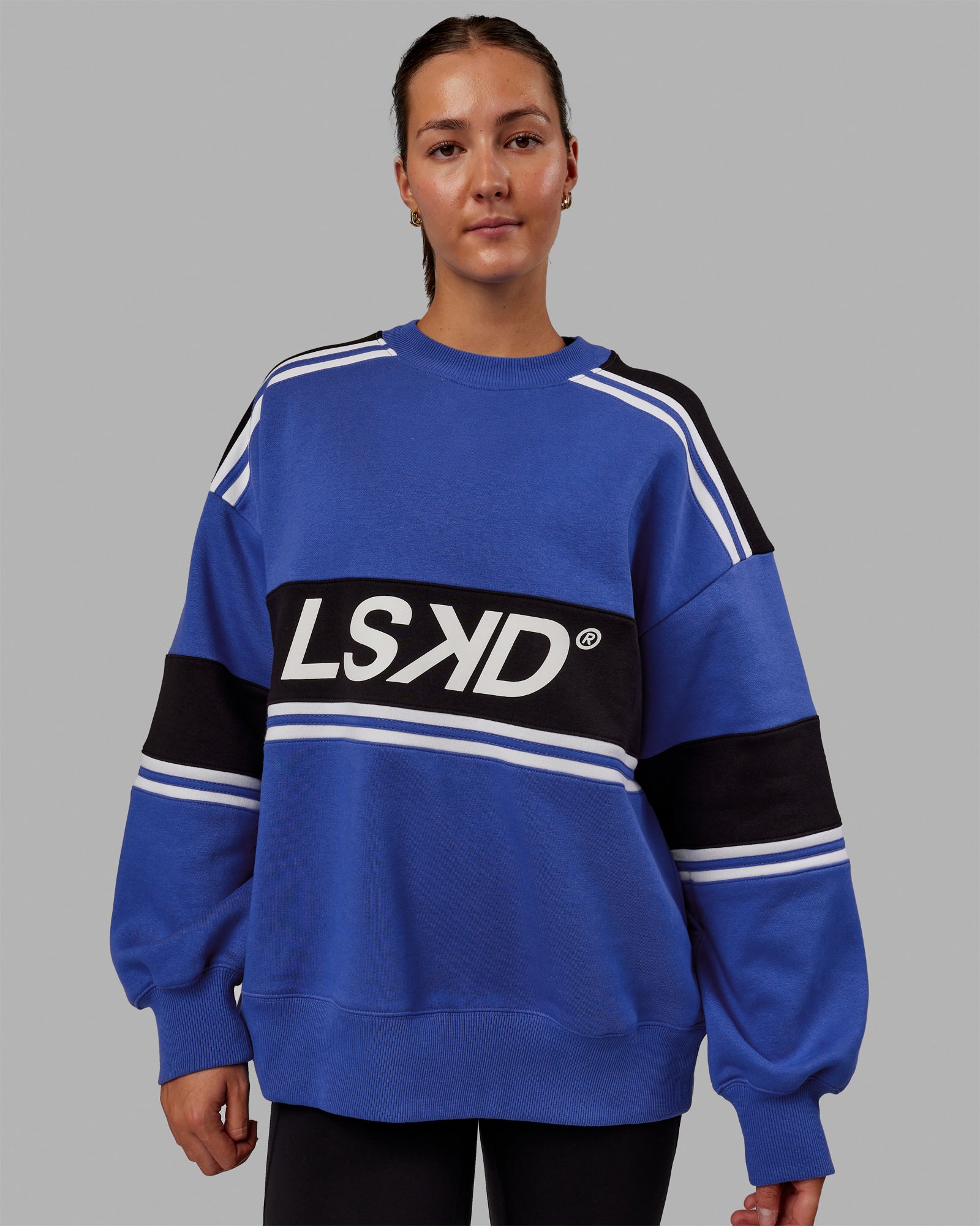 Woman wearing wearing Unisex A-Team Sweater Oversize - Power Cobalt-Black