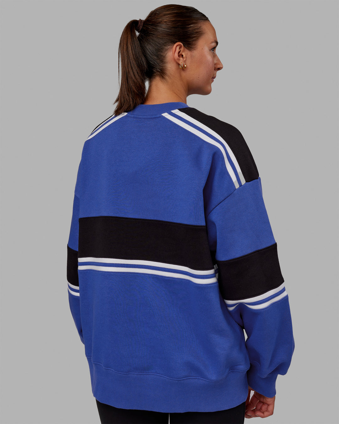 Woman wearing Unisex A-Team Sweater Oversize - Power Cobalt-Black - view 8