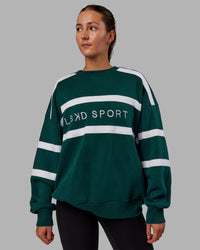 Woman wearing Unisex Collateral Sweater Oversize - Dark Moss-White | Thumbnail Index: 4