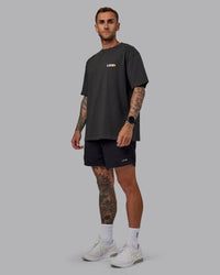 Man wearing Unisex E.T.J FLXCotton Tee Oversize - Pirate Black-Pop Pink | Thumbnail Index: 1