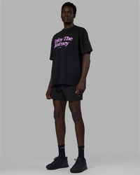 Man wearing Unisex Enjoy The Journey FLXCotton Tee Oversize - Black-Light Violet | Thumbnail Index: 2