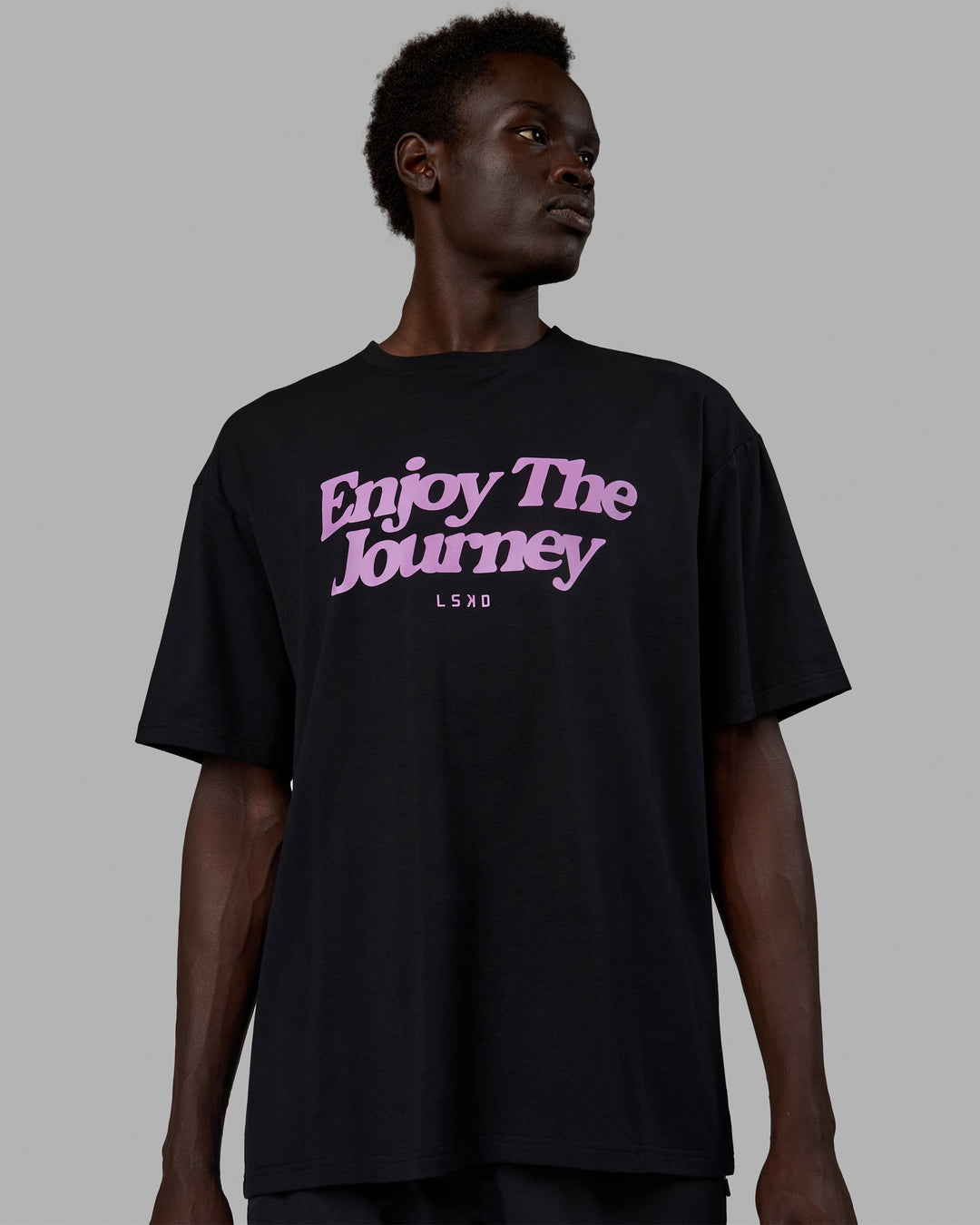 Man wearing Unisex Enjoy The Journey FLXCotton Tee Oversize - Black-Light Violet - view 5