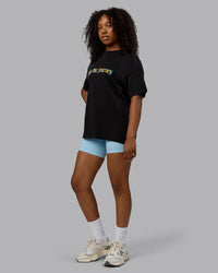 Woman wearing Unisex Enjoy The Journey Heavyweight Tee Oversize - Black-Multi | Thumbnail Index: 8