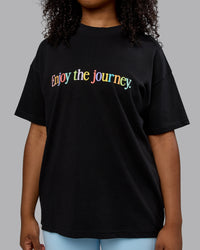 Woman wearing Unisex Enjoy The Journey Heavyweight Tee Oversize - Black-Multi | Thumbnail Index: 6