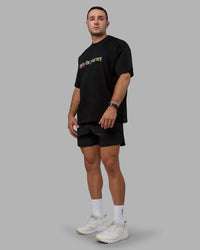 Man wearing Unisex Enjoy The Journey Heavyweight Tee Oversize - Black-Multi | Thumbnail Index: 4