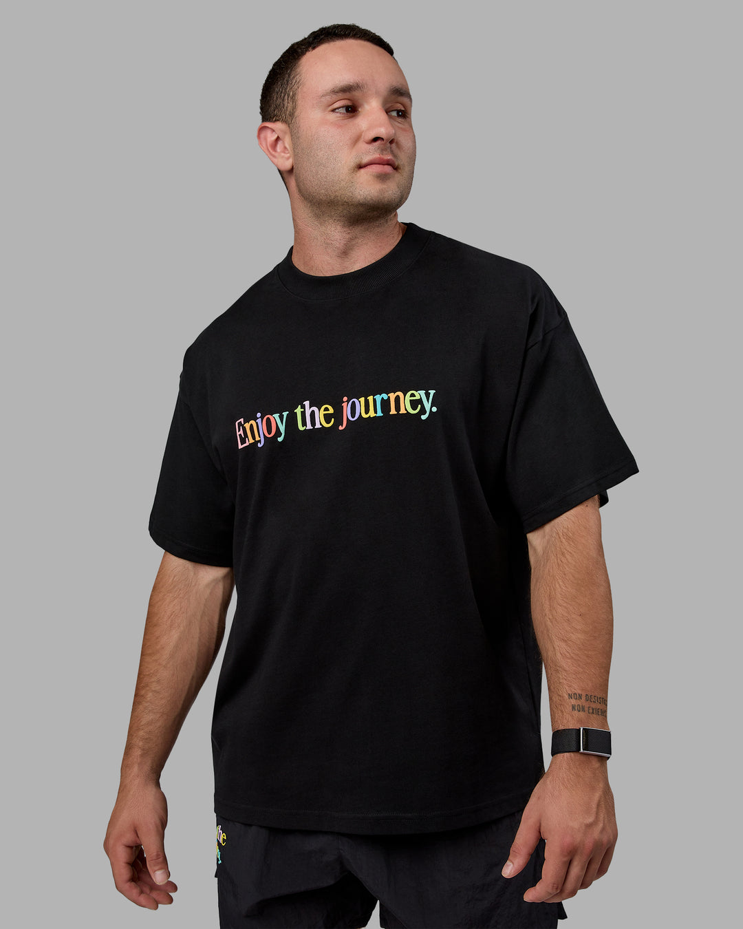 Man wearing Unisex Enjoy The Journey Heavyweight Tee Oversize - Black-Multi - view 2