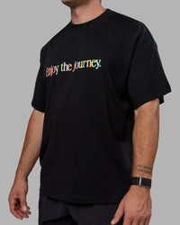 Man wearing Unisex Enjoy The Journey Heavyweight Tee Oversize - Black-Multi | Thumbnail Index: 10