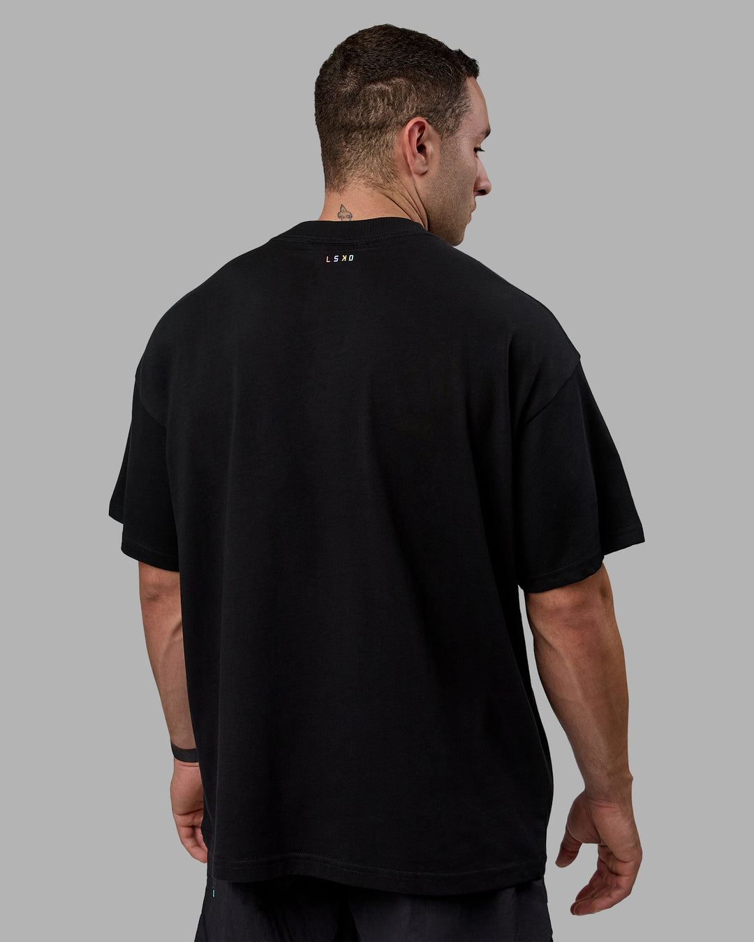 Man wearing Unisex Enjoy The Journey Heavyweight Tee Oversize - Black-Multi - view 4
