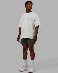 Man wearing Unisex Enjoy The Journey Heavyweight Tee Oversize - Off White-Multi | Thumbnail Index: 9