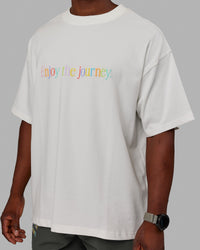 Man wearing Unisex Enjoy The Journey Heavyweight Tee Oversize - Off White-Multi | Thumbnail Index: 10