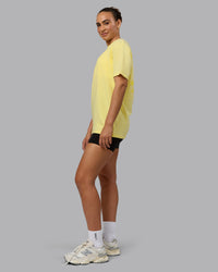 Woman wearing Unisex Enjoy the Journey Value Series FLXCotton Tee Oversize - Pale Yellow-Sundress | Thumbnail Index: 4