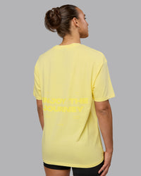 Woman wearing Unisex Enjoy the Journey Value Series FLXCotton Tee Oversize - Pale Yellow-Sundress | Thumbnail Index: 3