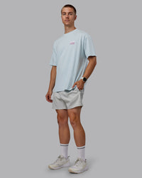 Man wearing Unisex Gone Running FLXCotton Tee Oversize - Skyride-Bubblegum | Thumbnail Index: 9