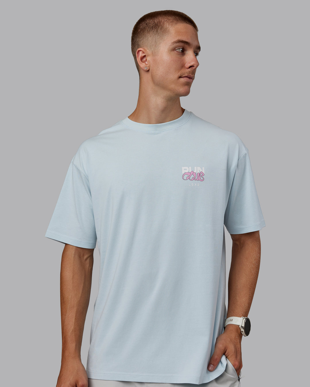 Man wearing Unisex Gone Running FLXCotton Tee Oversize - Skyride-Bubblegum - view 3