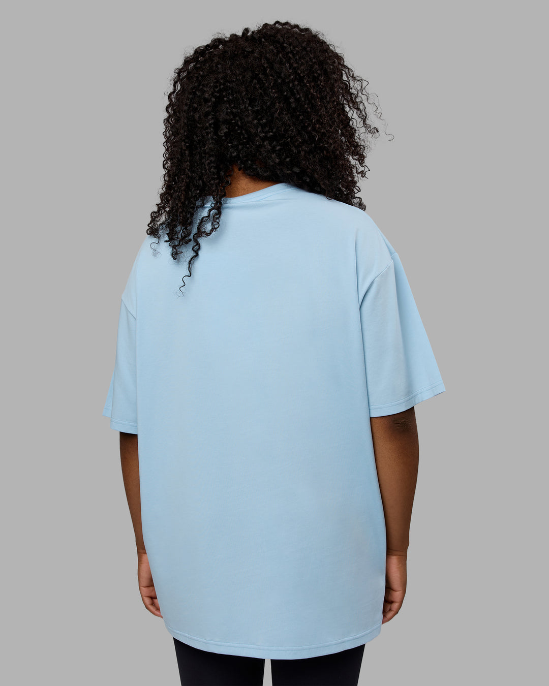 Woman wearing Unisex Just Keep Running FLXCotton Tee Oversize - Glacial Blue-Off White - view 9