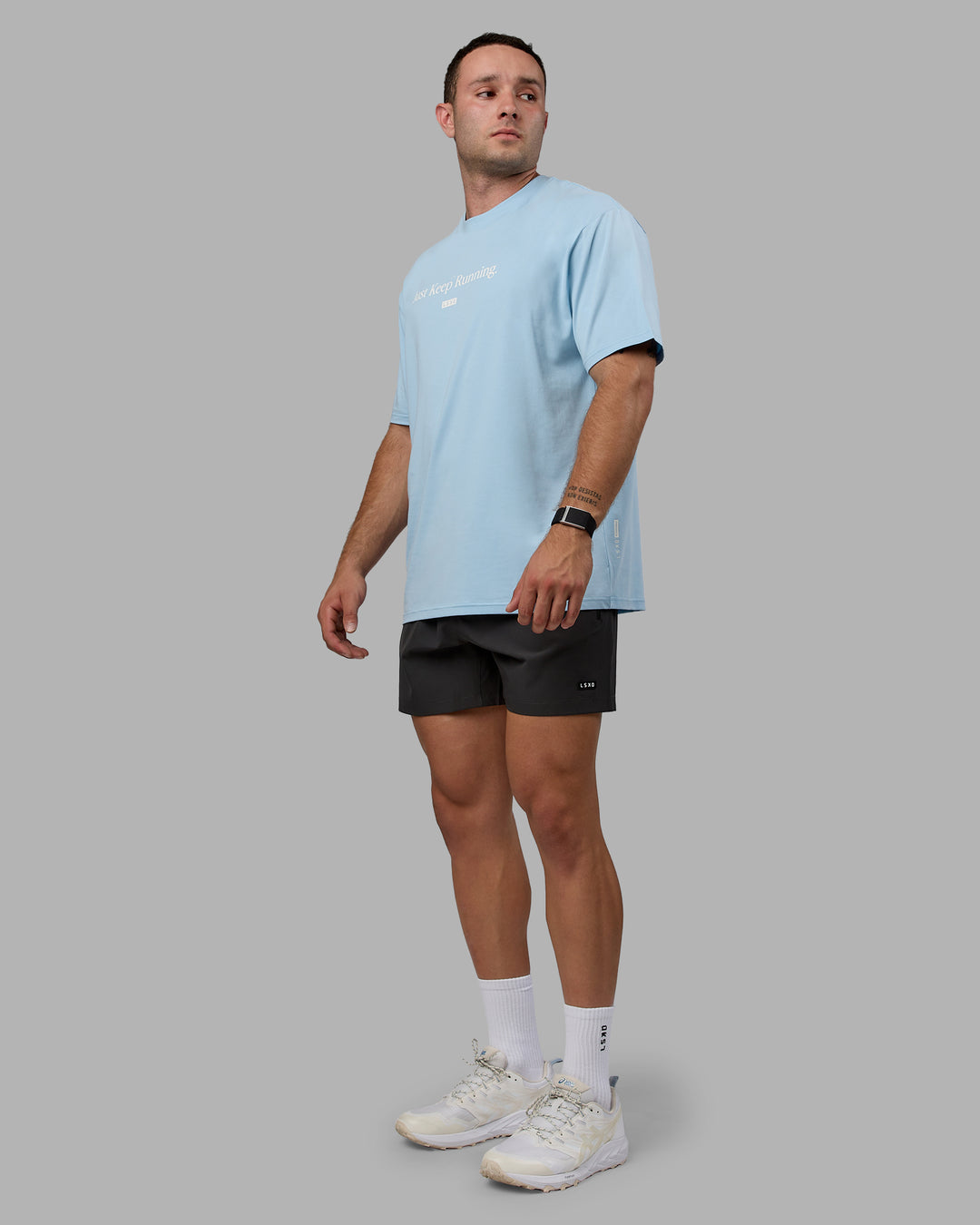 Man wearing Unisex Just Keep Running FLXCotton Tee Oversize - Glacial Blue-Off White - view 7