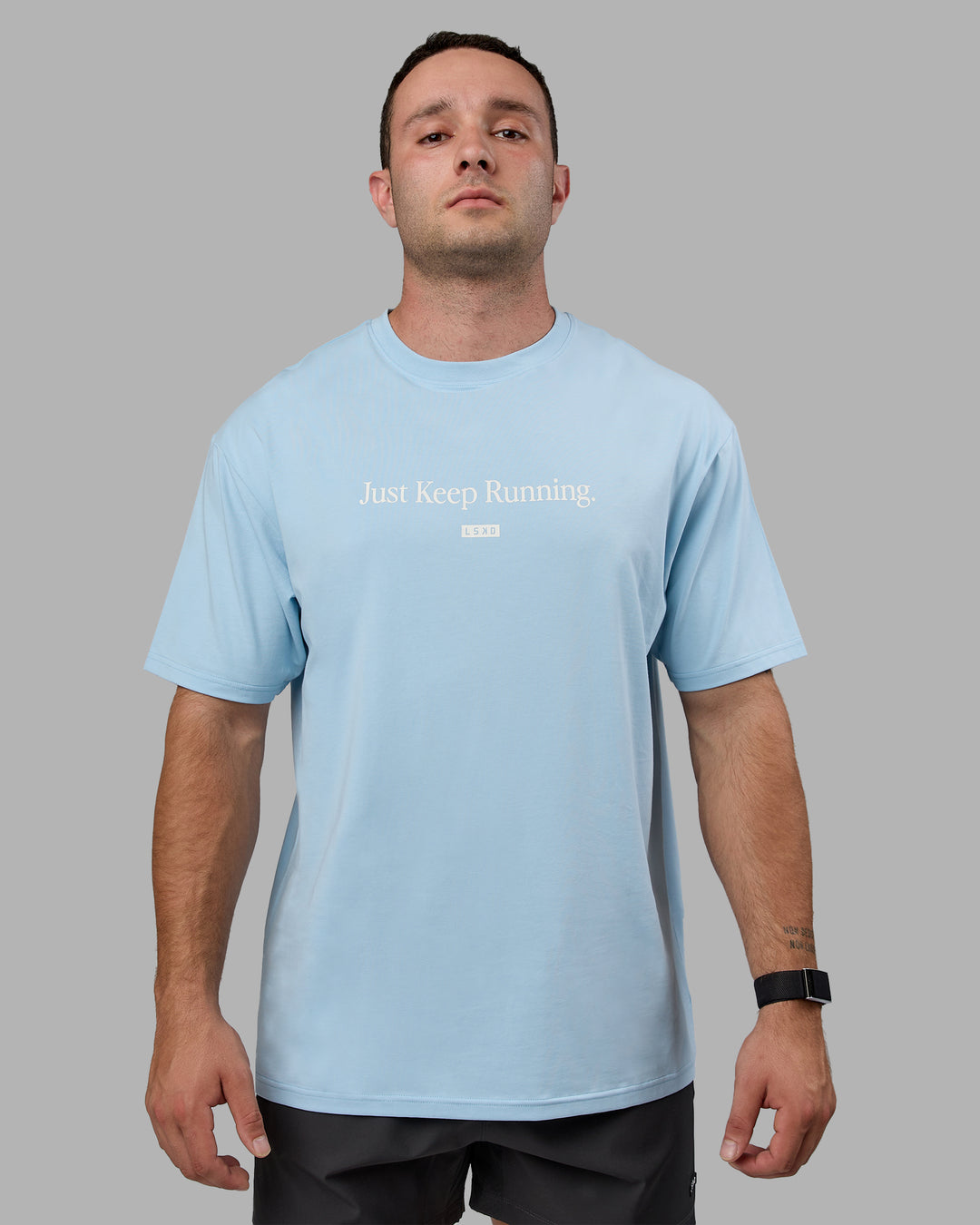 Man wearing Unisex Just Keep Running FLXCotton Tee Oversize - Glacial Blue-Off White - view 2