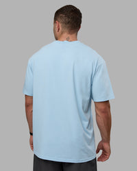 Man wearing Unisex Just Keep Running FLXCotton Tee Oversize - Glacial Blue-Off White | Thumbnail Index: 3