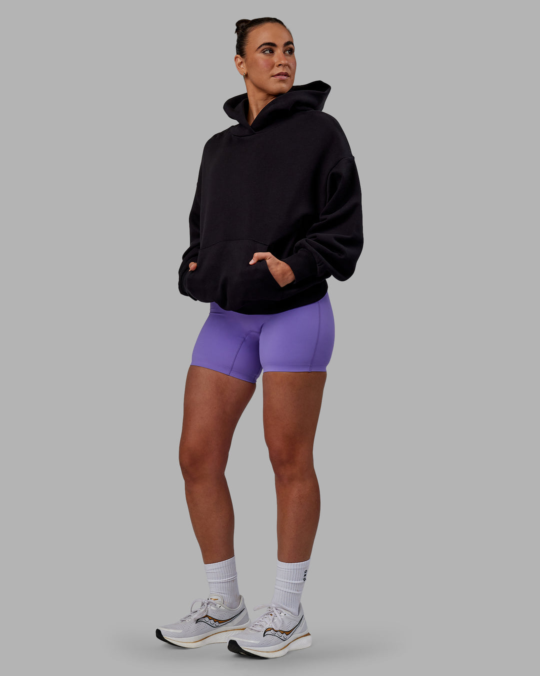 Woman wearing Unisex Keep on Running Hoodie Oversize - Black-White - view 5