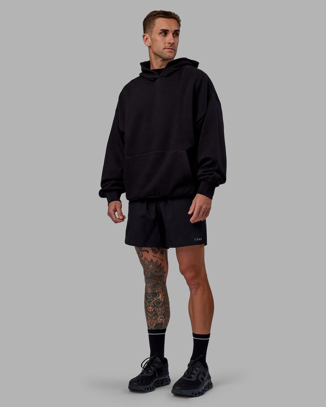 Man wearing Unisex Keep on Running Hoodie Oversize - Black-White - view 6