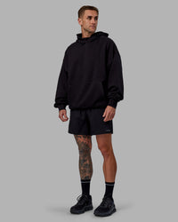 Man wearing Unisex Keep on Running Hoodie Oversize - Black-White | Thumbnail Index: 5