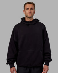 Man wearing Unisex Keep on Running Hoodie Oversize - Black-White | Thumbnail Index: 3