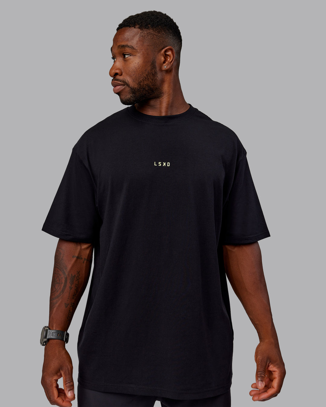 Man wearing Unisex Leg It FLXCotton Tee Oversize - Black-Volt - view 5