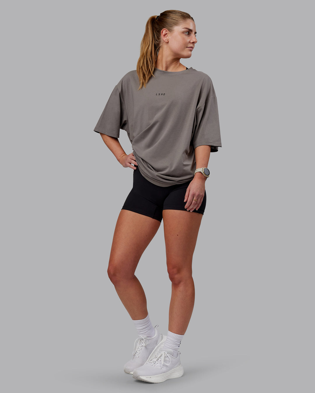 Woman wearing Unisex Leg It FLXCotton Tee Oversize - Storm Front-Black - view 5
