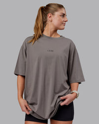 Woman wearing Unisex Leg It FLXCotton Tee Oversize - Storm Front-Black | Thumbnail Index: 2