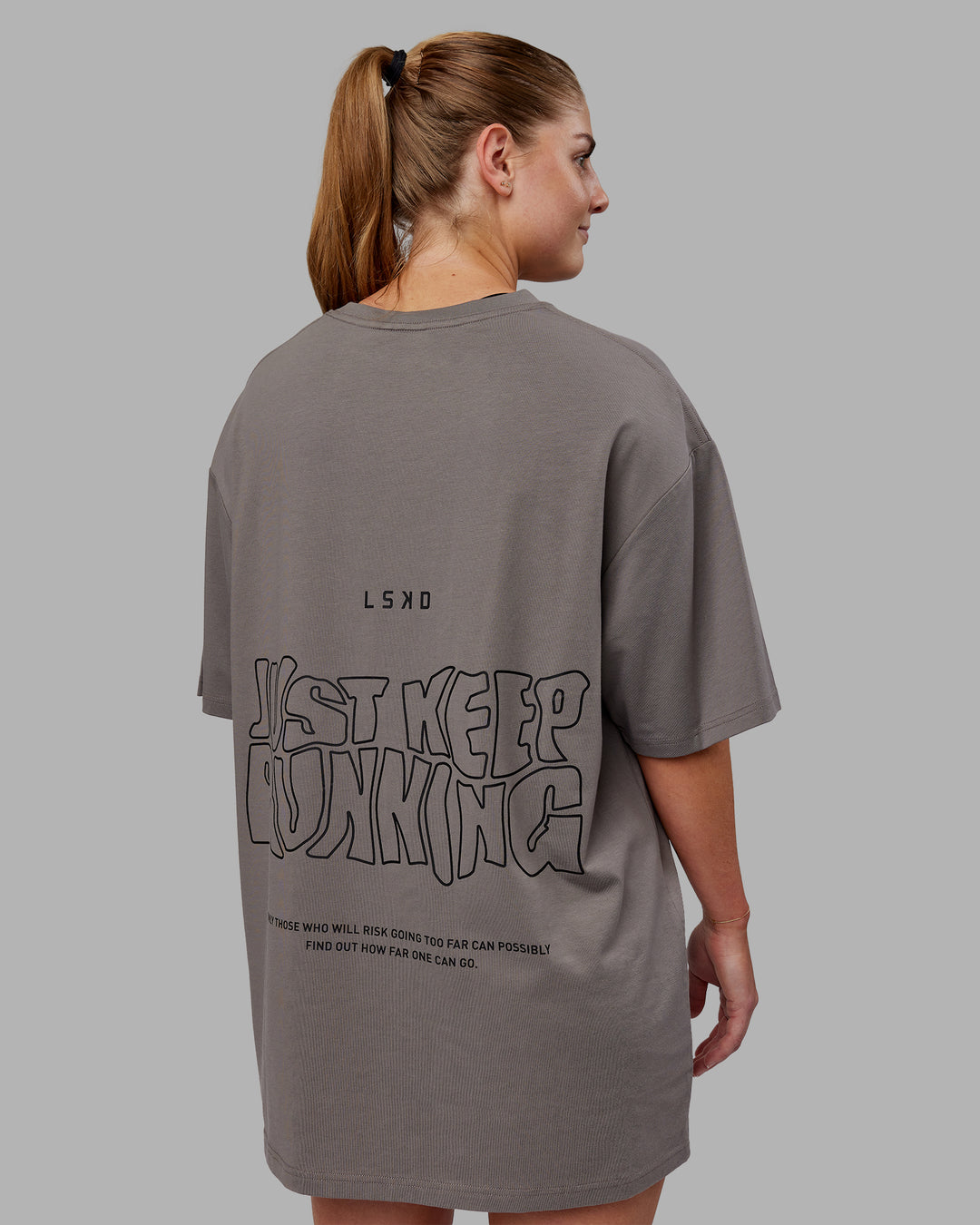 Woman wearing Unisex Leg It FLXCotton Tee Oversize - Storm Front-Black - view 7