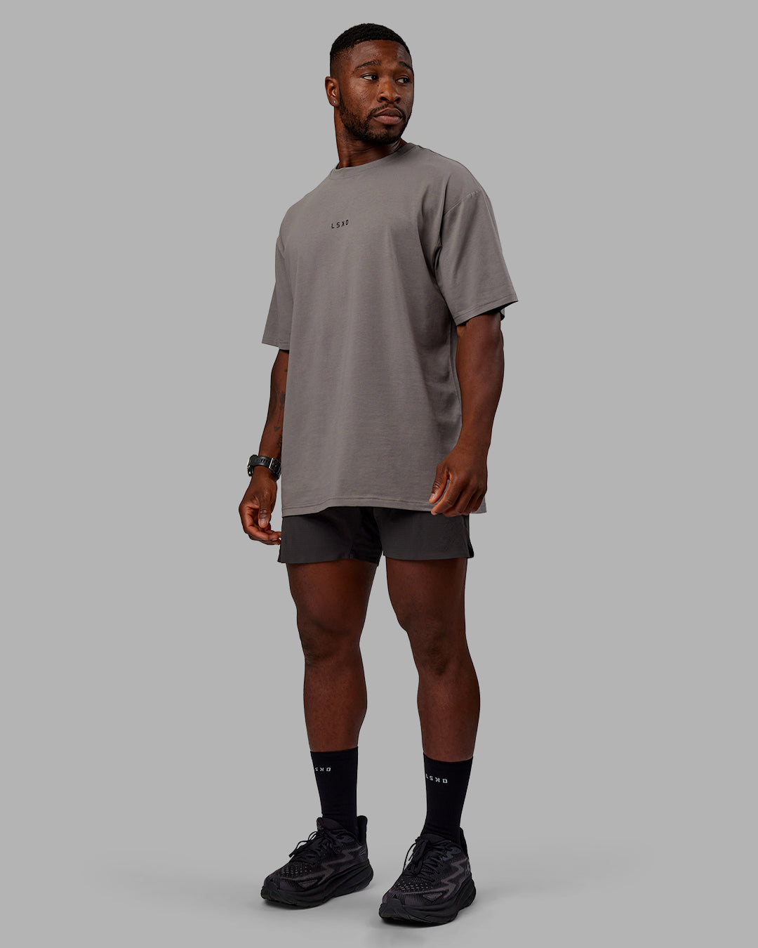 Man wearing Unisex Leg It FLXCotton Tee Oversize - Storm Front-Black - view 6