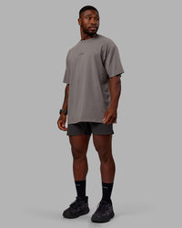 Man wearing Unisex Leg It FLXCotton Tee Oversize - Storm Front-Black | Thumbnail Index: 5