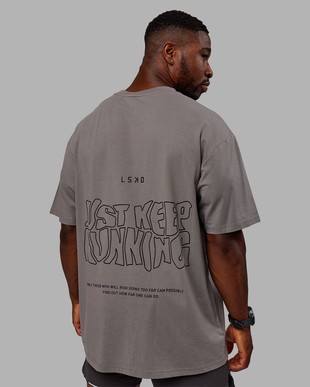 Man wearing Unisex Leg It FLXCotton Tee Oversize - Storm Front-Black - view 2