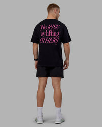 Man wearing Unisex Lift-Up FLXCotton Tee Oversize - Black-Fuschia Pink | Thumbnail Index: 11
