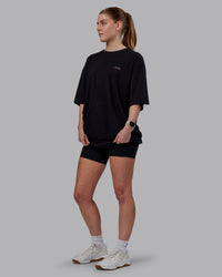Woman wearing Unisex Lift-Up FLXCotton Tee Oversize - Black-Fuschia Pink | Thumbnail Index: 5