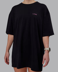 Woman wearing Unisex Lift-Up FLXCotton Tee Oversize - Black-Fuschia Pink | Thumbnail Index: 9