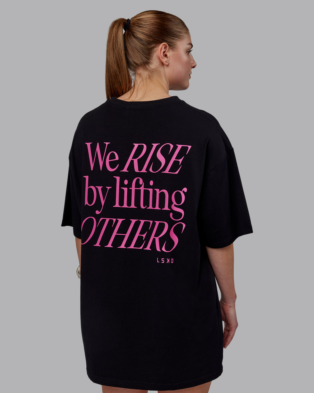Woman wearing Unisex Lift-Up FLXCotton Tee Oversize - Black-Fuschia Pink - view 2