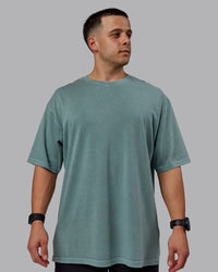 Man wearing Unisex Washed Lifting Club Heavyweight Tee Oversize - Storm-Black | Thumbnail Index: 1