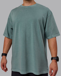 Man wearing Unisex Washed Lifting Club Heavyweight Tee Oversize - Storm-Black | Thumbnail Index: 10