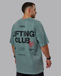 Man wearing Unisex Washed Lifting Club Heavyweight Tee Oversize - Storm-Black | Thumbnail Index: 6