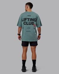 Man wearing Unisex Washed Lifting Club Heavyweight Tee Oversize - Storm-Black | Thumbnail Index: 11