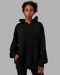 Woman wearing Unisex Love The Run Hoodie Oversize - Black-White | Thumbnail Index: 6