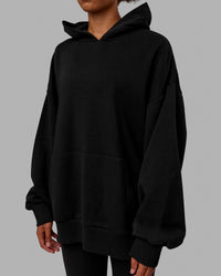 Woman wearing Unisex Love The Run Hoodie Oversize - Black-White | Thumbnail Index: 9