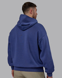 Man wearing Unisex MVP Hoodie Oversize - Future Dusk | Thumbnail Index: 3