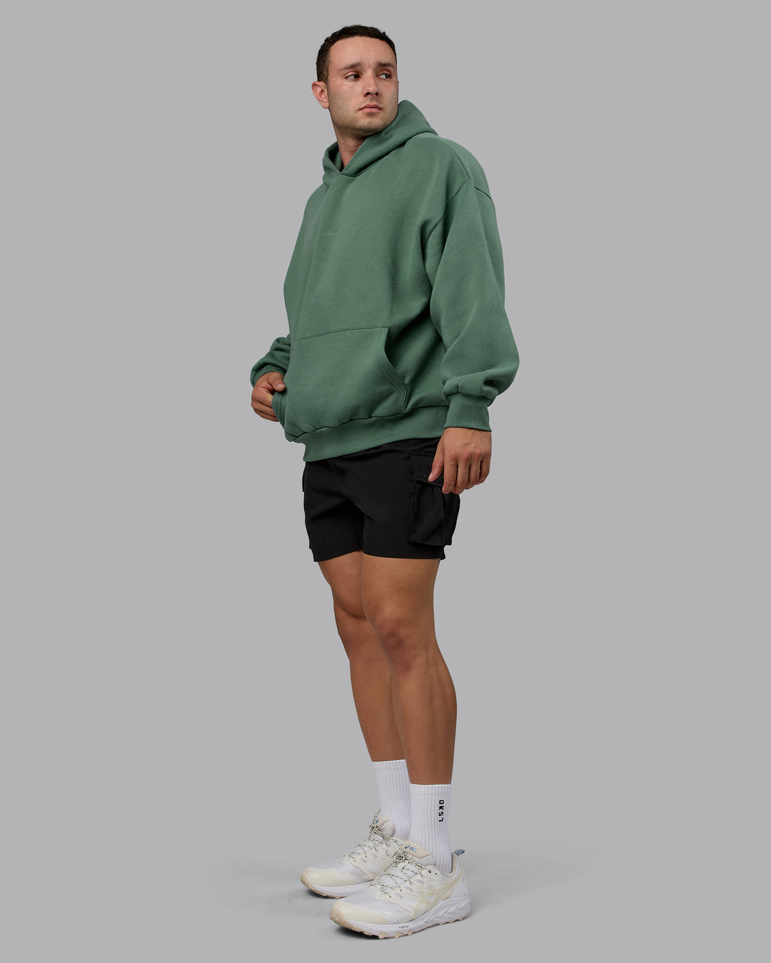 Man wearing Unisex MVP Hoodie Oversize - Sage Brush - view 9