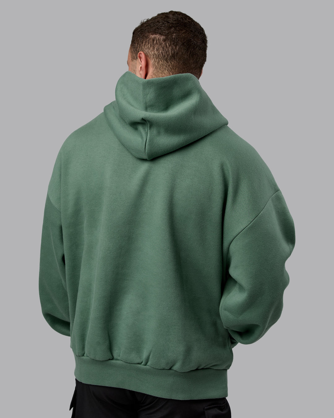 Man wearing Unisex MVP Hoodie Oversize - Sage Brush - view 4