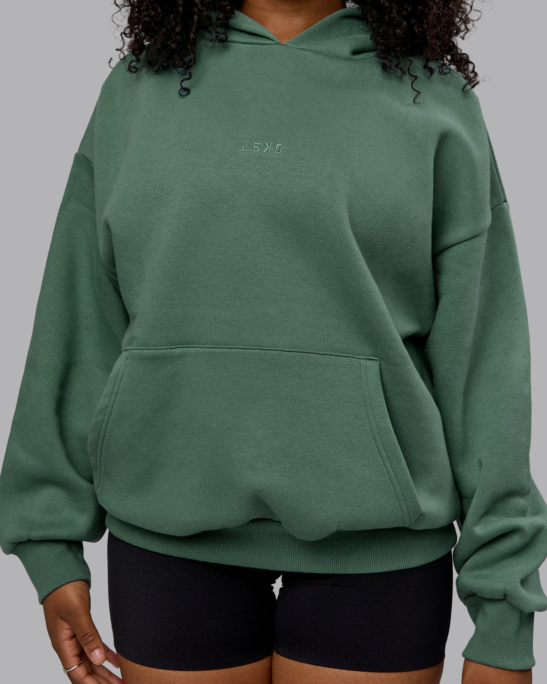 Woman wearing Unisex MVP Hoodie Oversize - Sage Brush - view 7