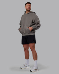 Man wearing Unisex MVP Hoodie Oversize - Storm Front | Thumbnail Index: 2
