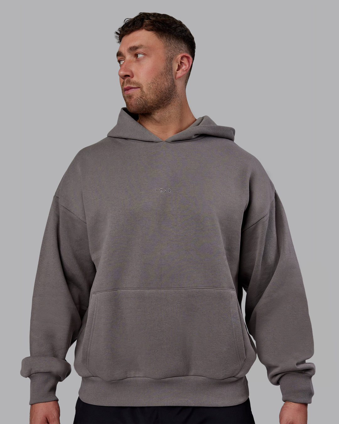 Man wearing Unisex MVP Hoodie Oversize - Storm Front - view 6
